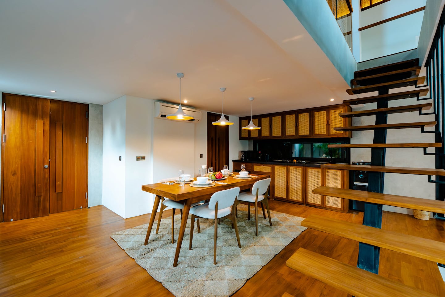 Sculptural staircase and dining space