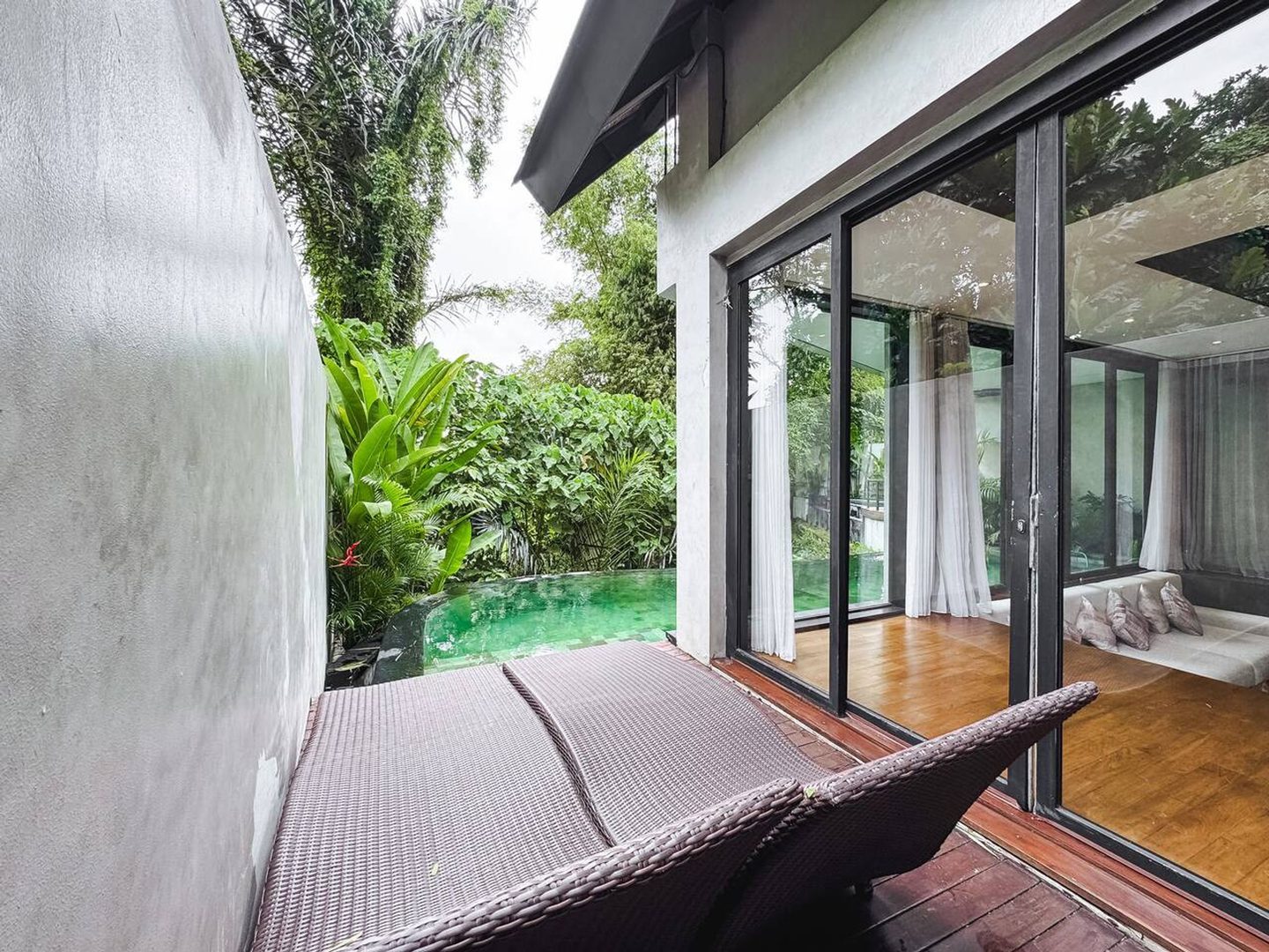Indoor hammock strung beside the open glass